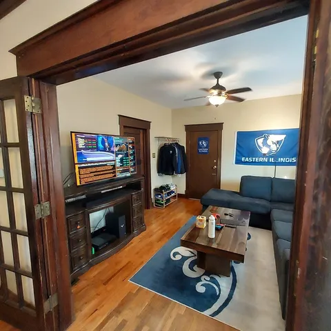 a living room with furniture and a flat screen tv