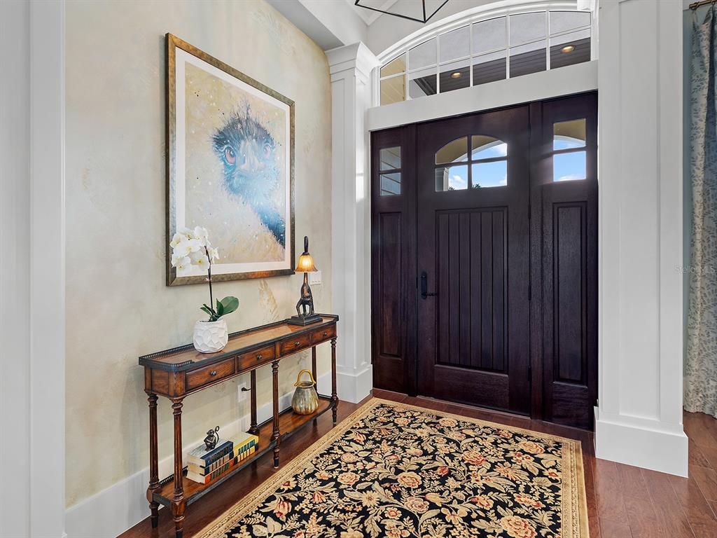 16336 Daysailor Trail Lakewood Ranch, FL 34202 - Photo 15 of 88 a view of a hallway with wooden floor and entryway