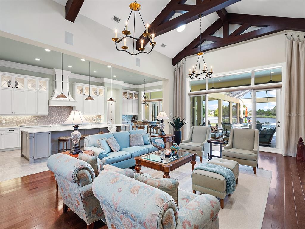 16336 Daysailor Trail Lakewood Ranch, FL 34202 - Photo 17 of 88 a living room with furniture kitchen view and a large window