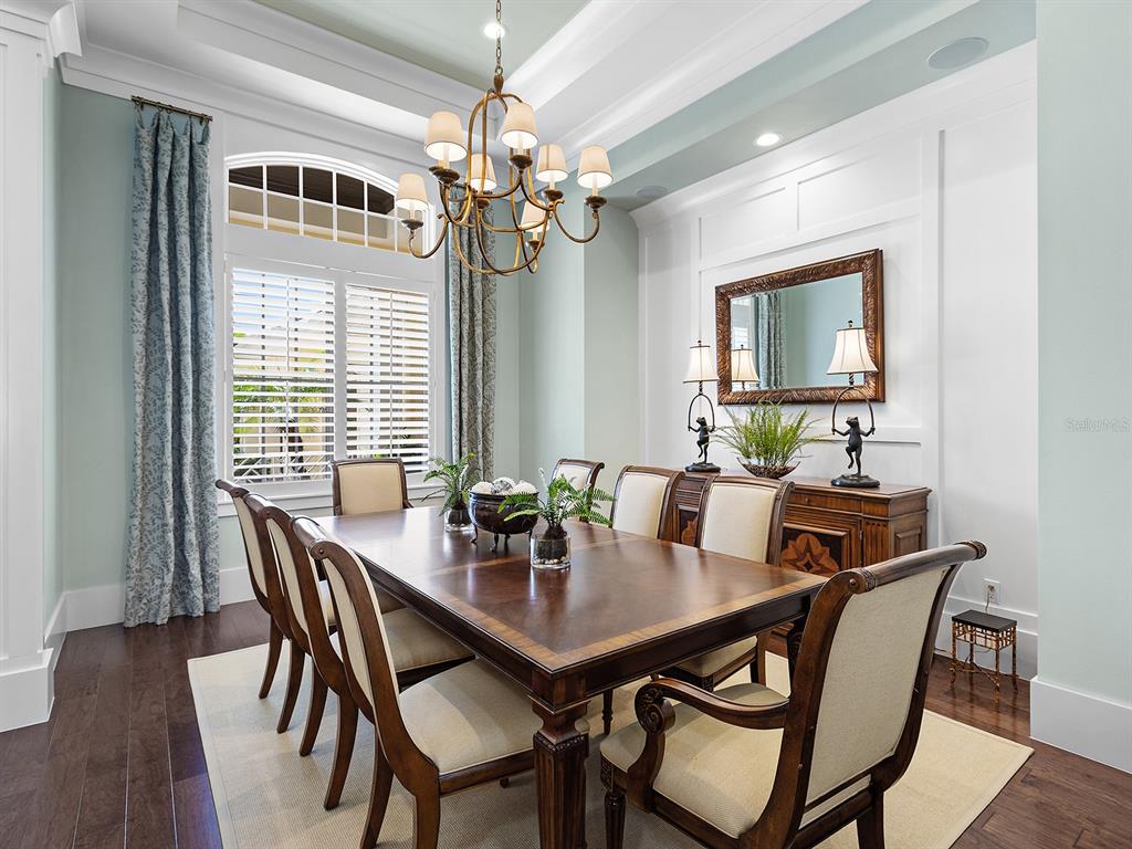 16336 Daysailor Trail Lakewood Ranch, FL 34202 - Photo 24 of 88 a view of a dining room with furniture window and wooden floor