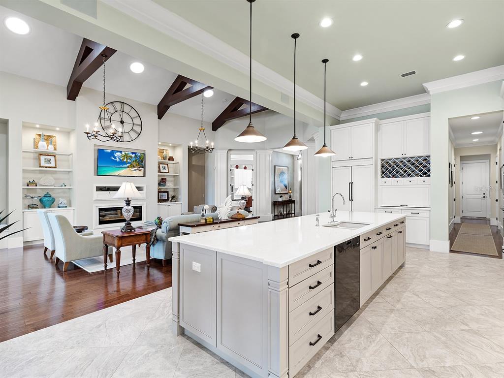 16336 Daysailor Trail Lakewood Ranch, FL 34202 - Photo 29 of 88 a large white kitchen with lots of counter space and painting on the wall