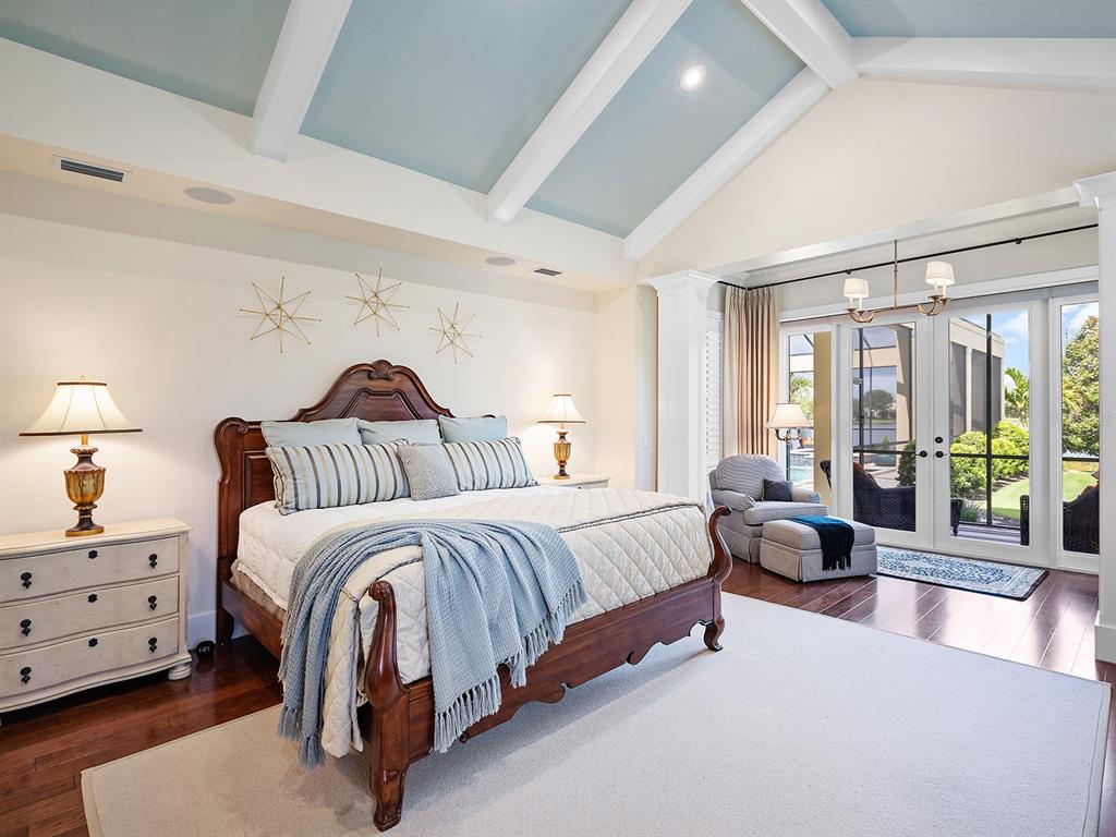 16336 Daysailor Trail Lakewood Ranch, FL 34202 - Photo 36 of 88 a spacious bedroom with a bed and a couch