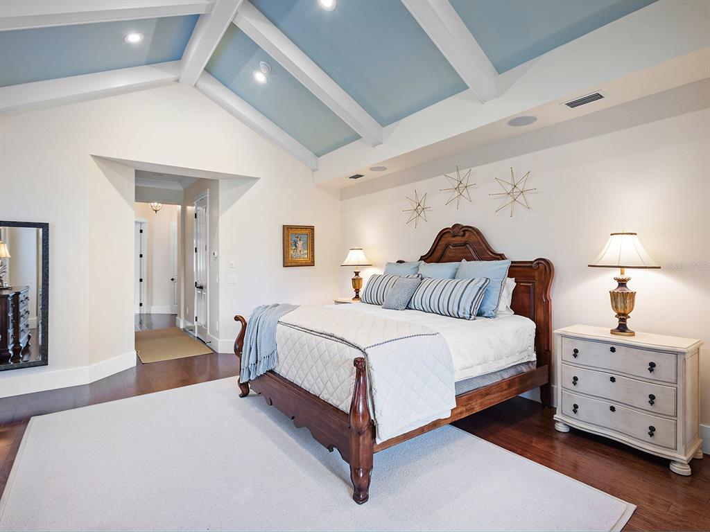 16336 Daysailor Trail Lakewood Ranch, FL 34202 - Photo 40 of 88 a spacious bedroom with a bed and a lamp