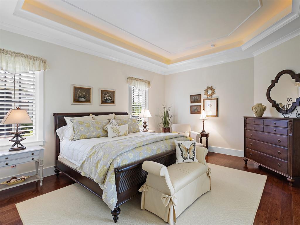 16336 Daysailor Trail Lakewood Ranch, FL 34202 - Photo 46 of 88 a bedroom with a bed and dresser with mirror