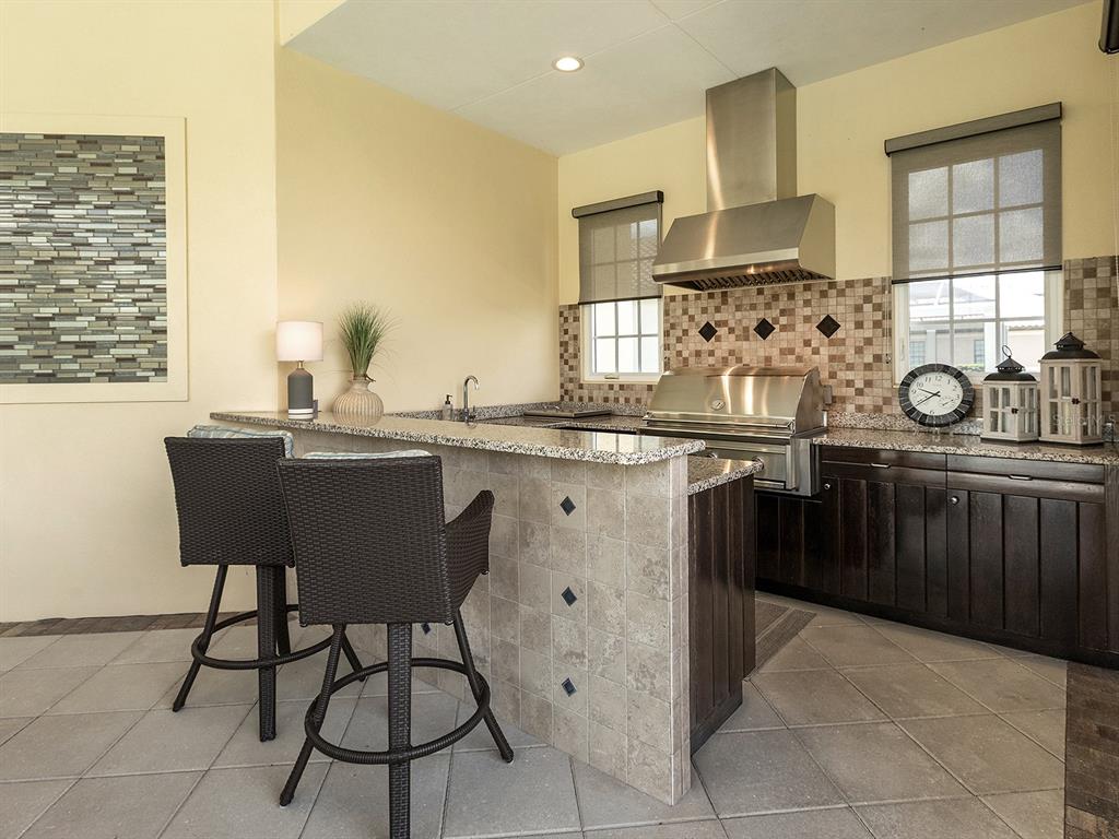 16336 Daysailor Trail Lakewood Ranch, FL 34202 - Photo 58 of 88 a kitchen with stainless steel appliances a sink counter space and windows