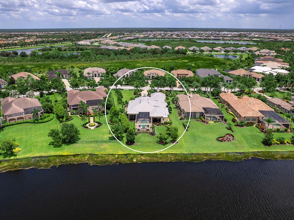 16336 Daysailor Trail Lakewood Ranch, FL 34202 - Photo 69 of 88 an aerial view of a house with a garden and mountain view in back