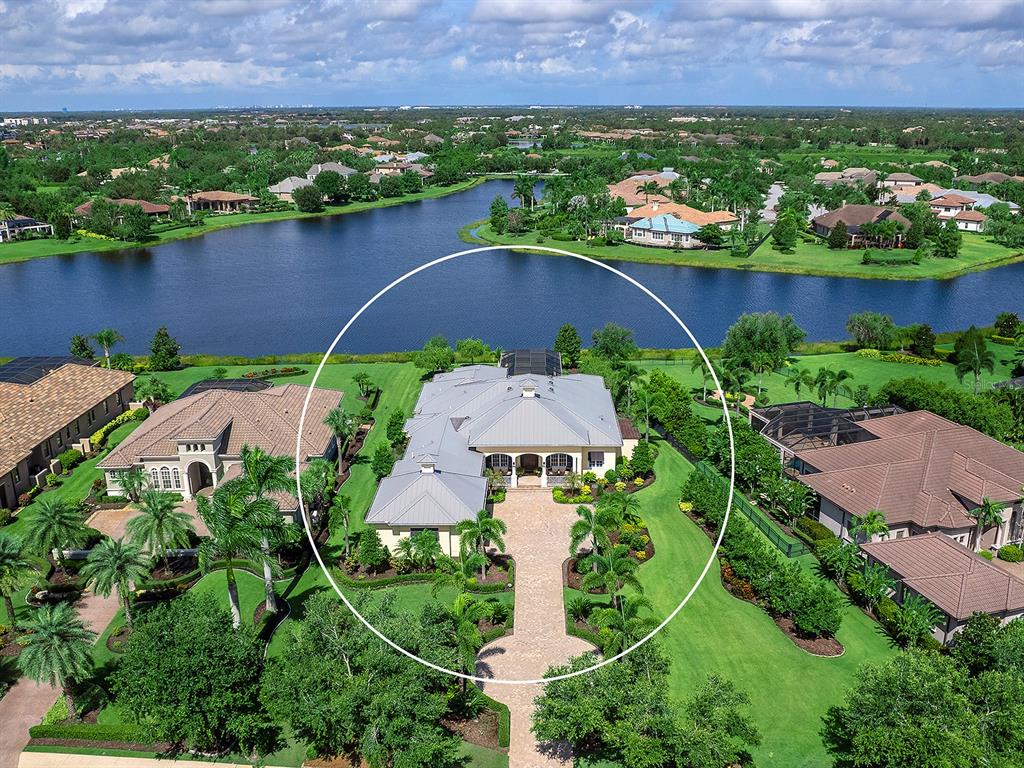 16336 Daysailor Trail Lakewood Ranch, FL 34202 - Photo 70 of 88 an aerial view of residential house with outdoor space and lake view