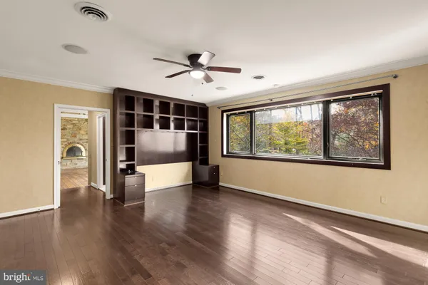 a spacious bathroom with a granite countertop sink and a mirror