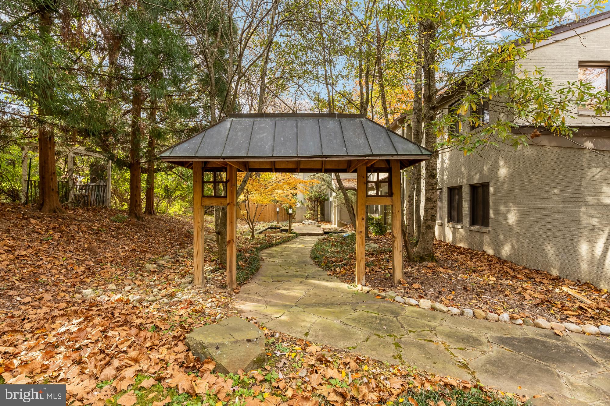 1434 Kirby Road McLean, VA 22101 - Photo 4 of 54 a backyard of a house with table and chairs