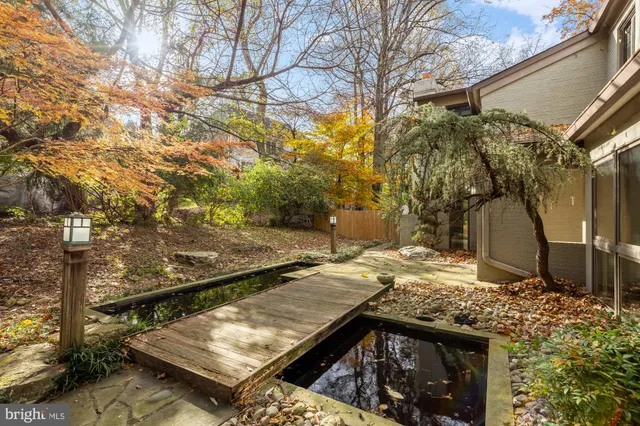 a view of a backyard with iron fence