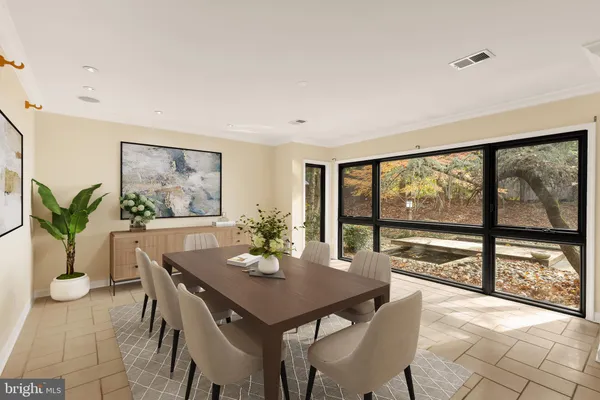 a view of a dining room with furniture window and outside view