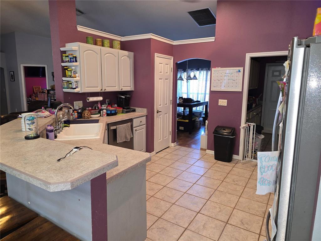 5904 Southwest 107th Street Ocala, FL 34476 - Photo 20 of 33 a kitchen with a sink appliances and cabinets