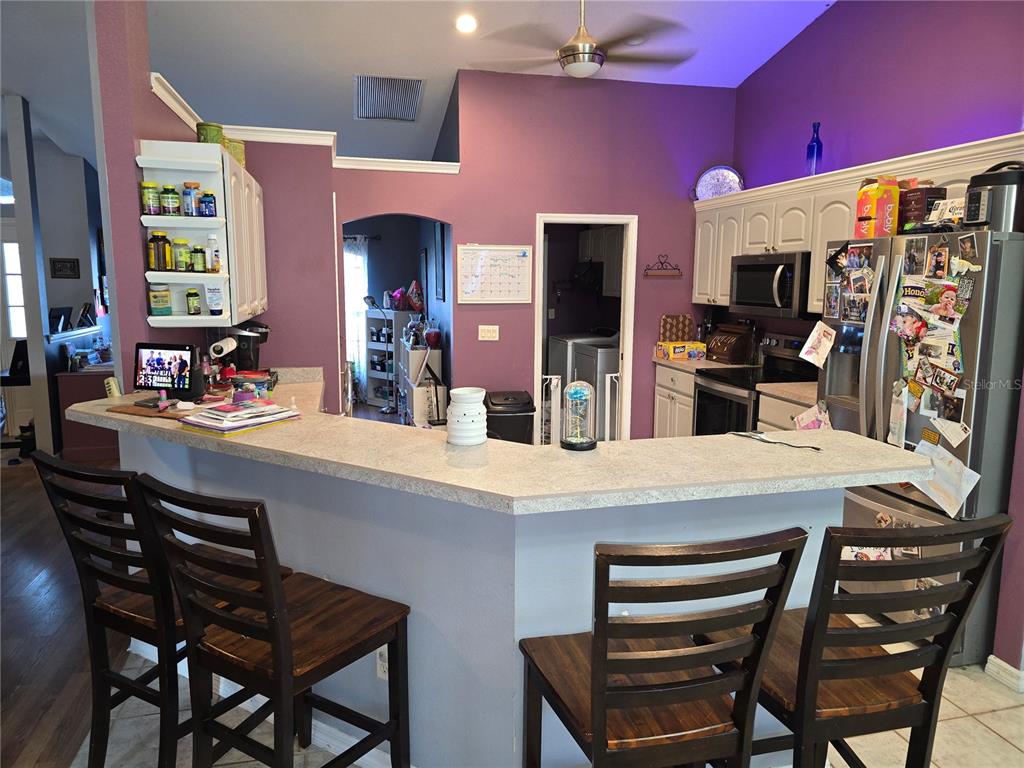 5904 Southwest 107th Street Ocala, FL 34476 - Photo 21 of 33 a kitchen with a table and chairs in it