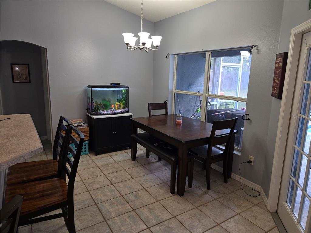 5904 Southwest 107th Street Ocala, FL 34476 - Photo 22 of 33 a view of a dining room with furniture