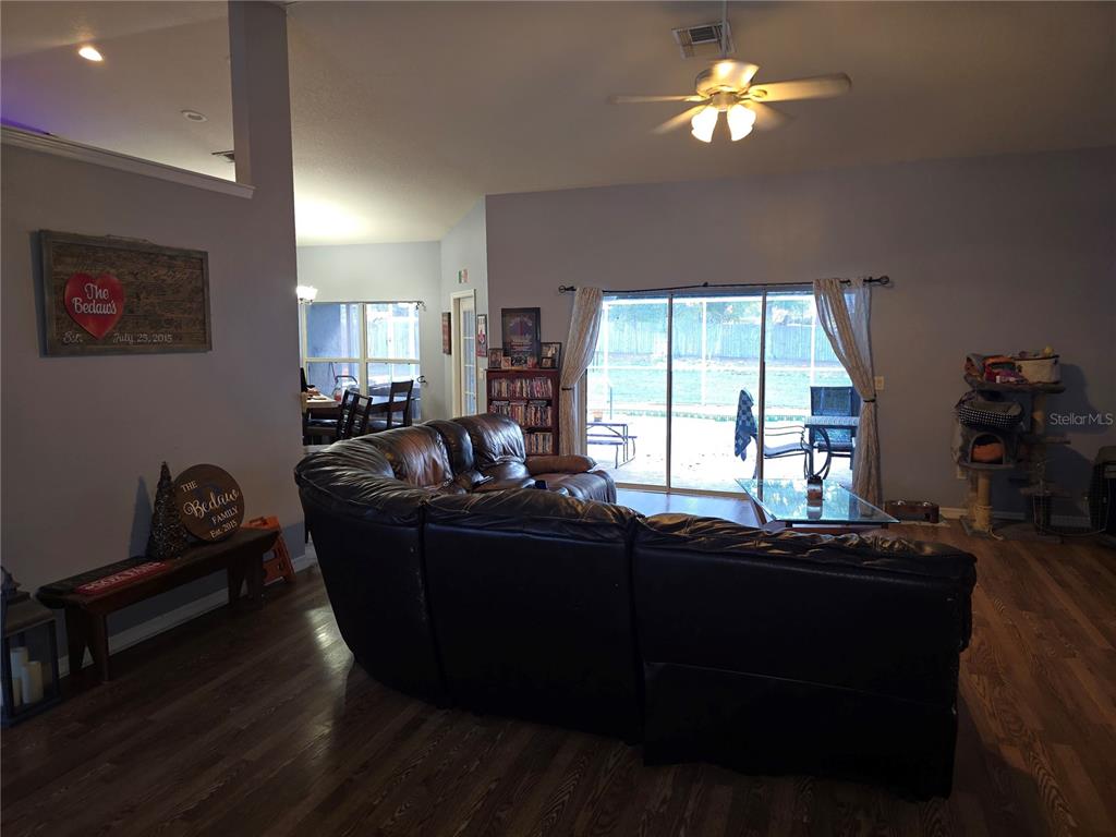 5904 Southwest 107th Street Ocala, FL 34476 - Photo 23 of 33 a living room with furniture and a window