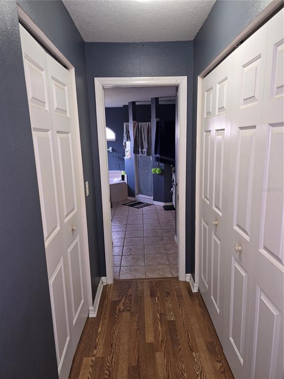 5904 Southwest 107th Street Ocala, FL 34476 - Photo 27 of 33 a view of a hallway view with wooden floor and staircase