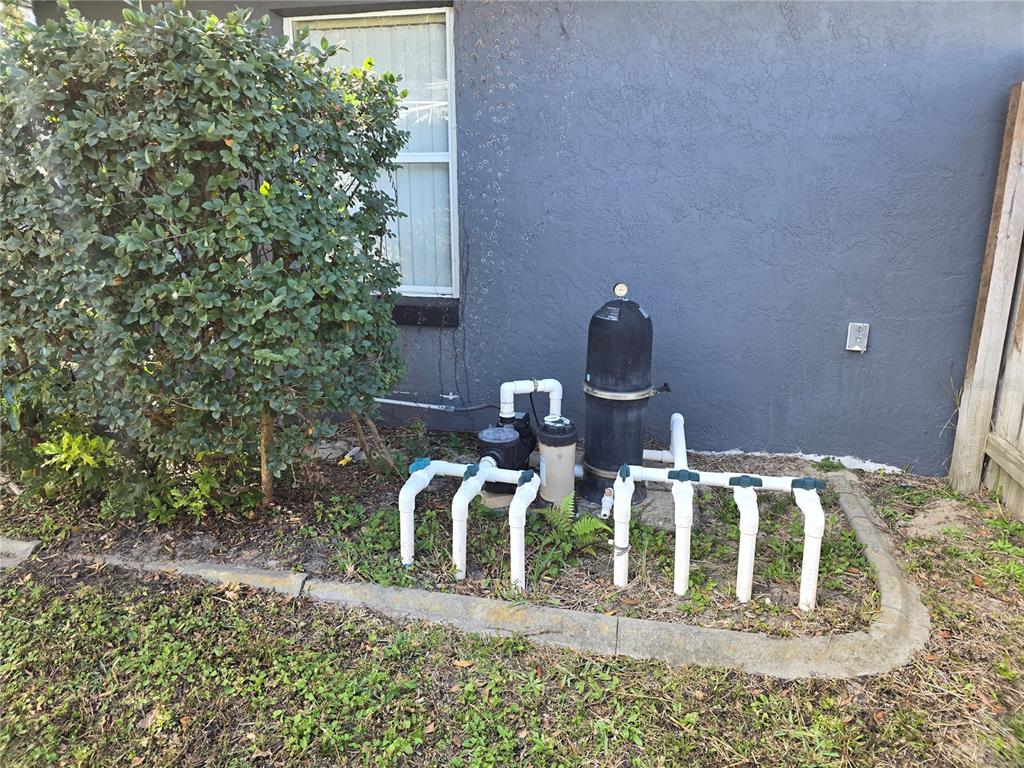 5904 Southwest 107th Street Ocala, FL 34476 - Photo 8 of 33 a front view of a house with lots of trees