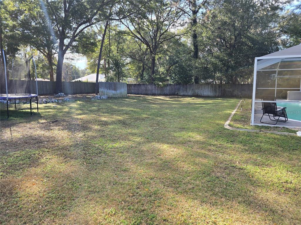 5904 Southwest 107th Street Ocala, FL 34476 - Photo 10 of 33 a view of pool with trees