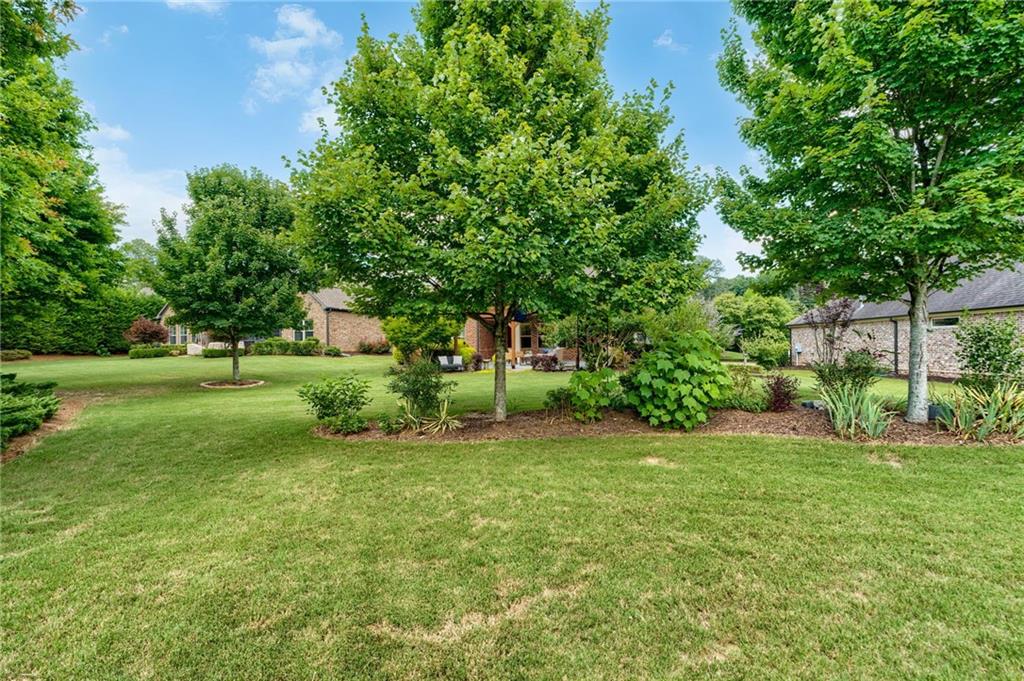 4735 Amble Trace Cumming, GA 30040 - Photo 60 of 73 a view of a house with a big yard
