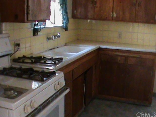 a kitchen with a stove and a cabinets