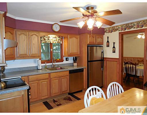 123 5th Street Middlesex, NJ 08846 - Photo 2 of 9 a kitchen with a refrigerator and a sink