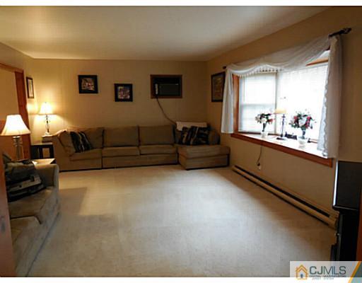 123 5th Street Middlesex, NJ 08846 - Photo 4 of 9 a living room with furniture and a window