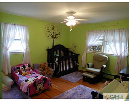 123 5th Street Middlesex, NJ 08846 - Photo 6 of 9 a bedroom with a bed and window