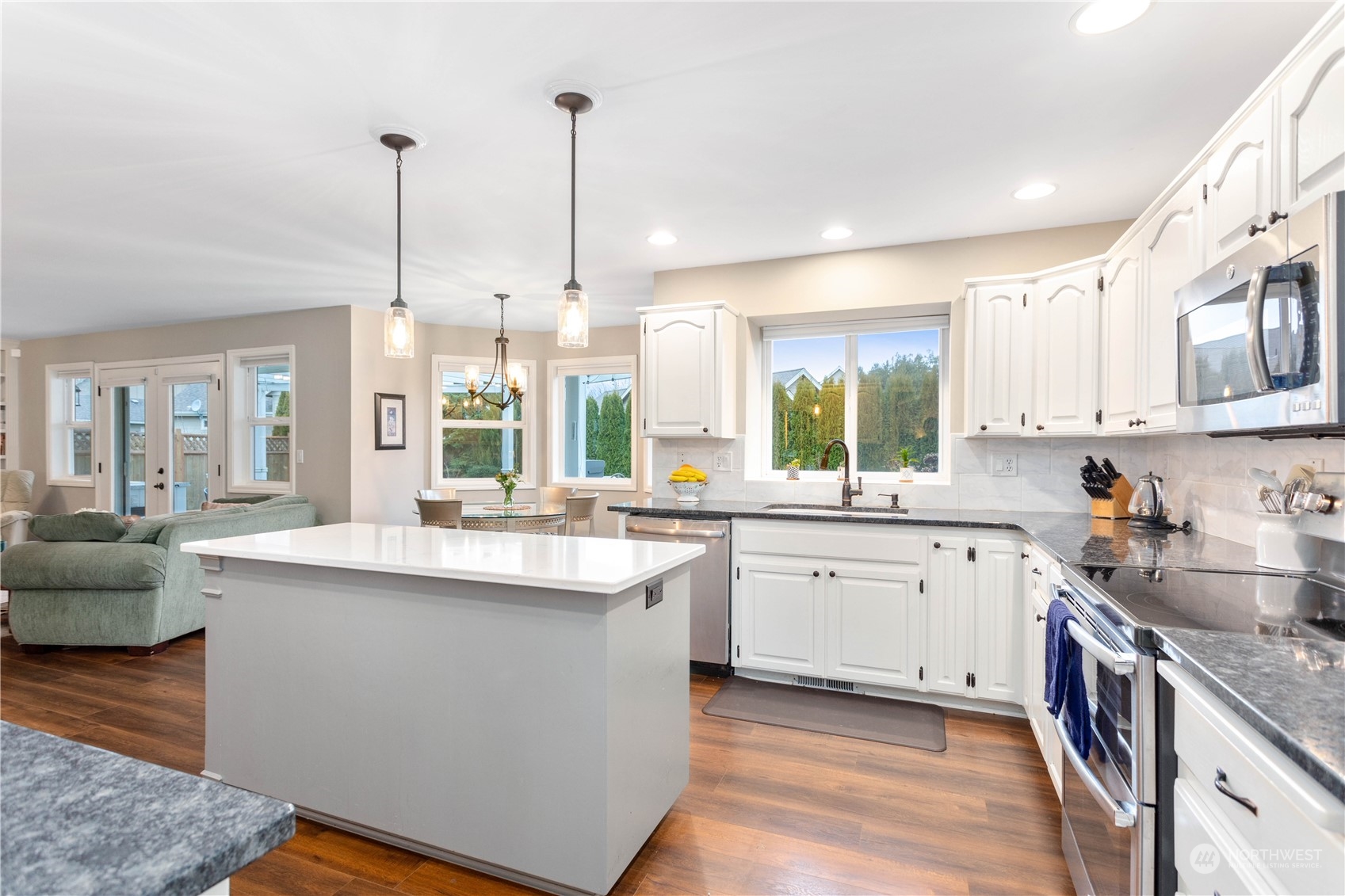 212 Springview Drive Lynden, WA 98264 - Photo 12 of 40 a kitchen with stainless steel appliances granite countertop a sink a stove and cabinets