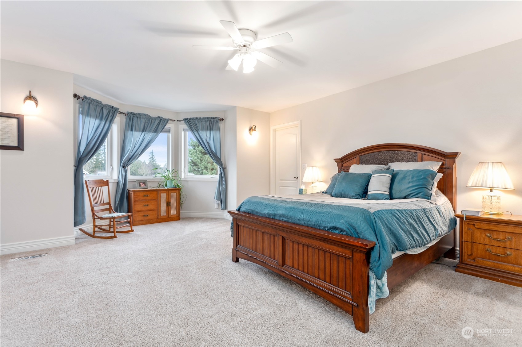 212 Springview Drive Lynden, WA 98264 - Photo 22 of 40 a bedroom with a bed and a ceiling fan