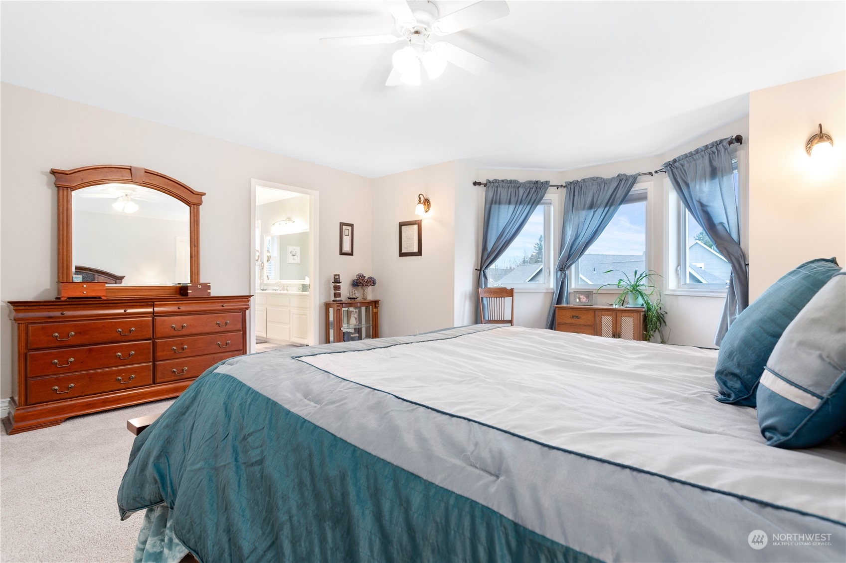 212 Springview Drive Lynden, WA 98264 - Photo 24 of 40 a bedroom with a bed and a mirror on the dresser