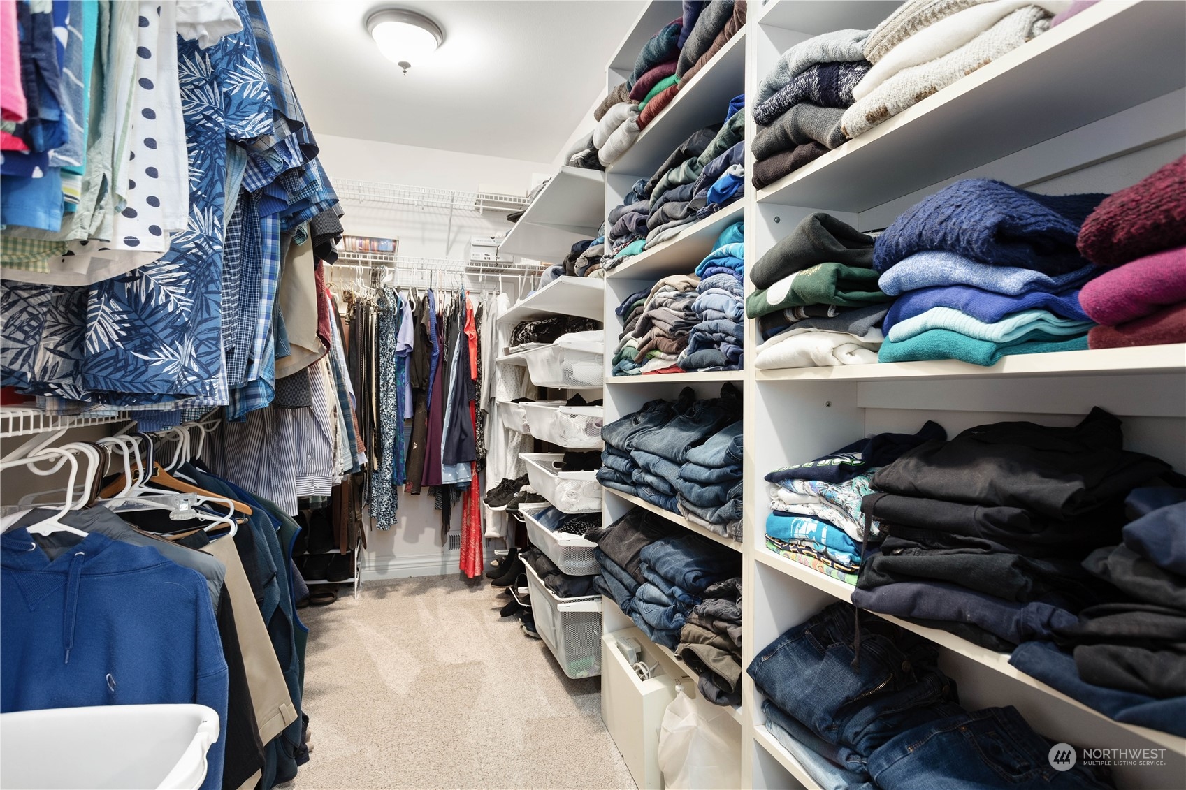 212 Springview Drive Lynden, WA 98264 - Photo 29 of 40 a view of walk in closet with clothes and shoes