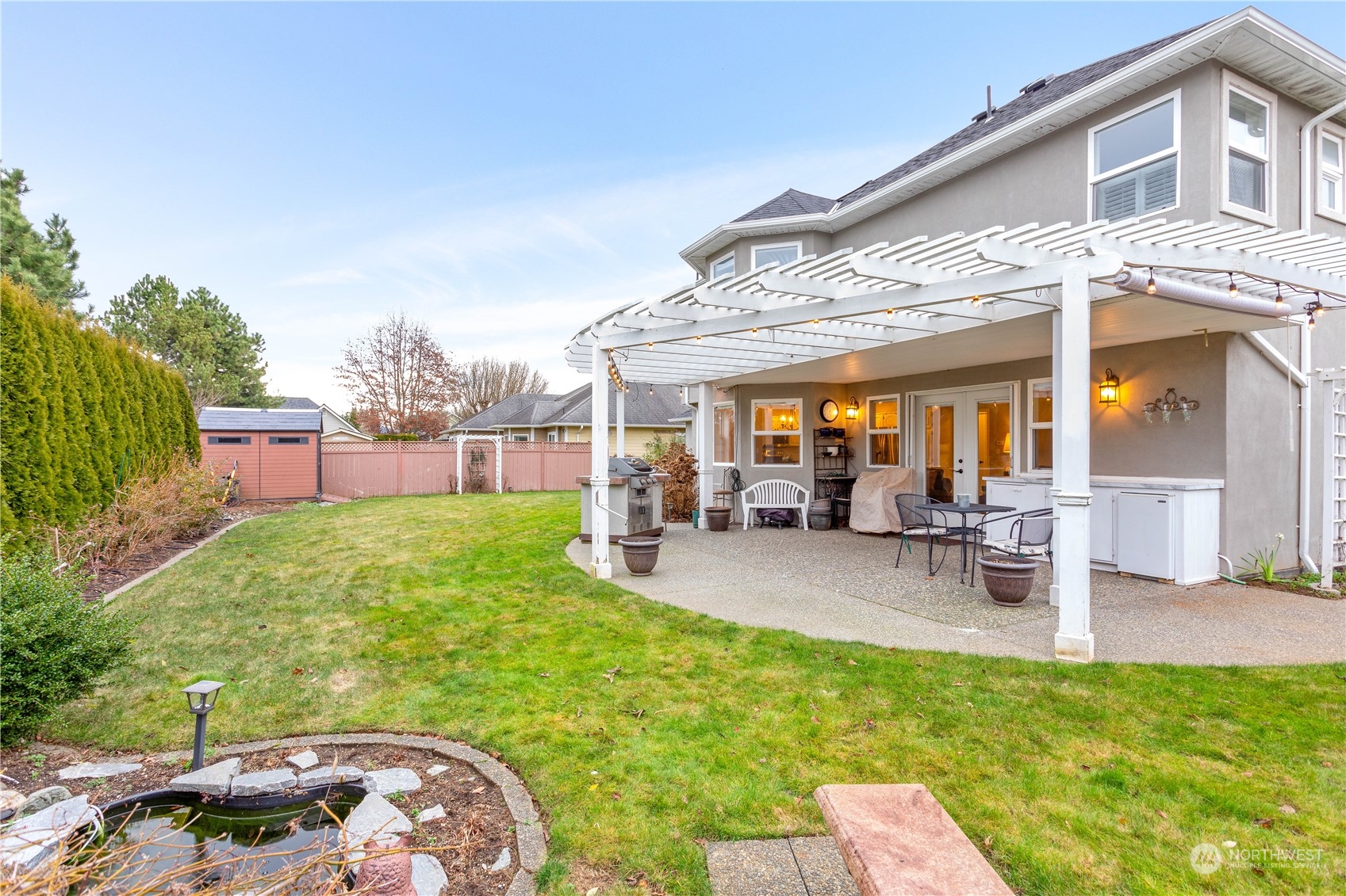 212 Springview Drive Lynden, WA 98264 - Photo 33 of 40 a view of a backyard with a patio and outdoor seating