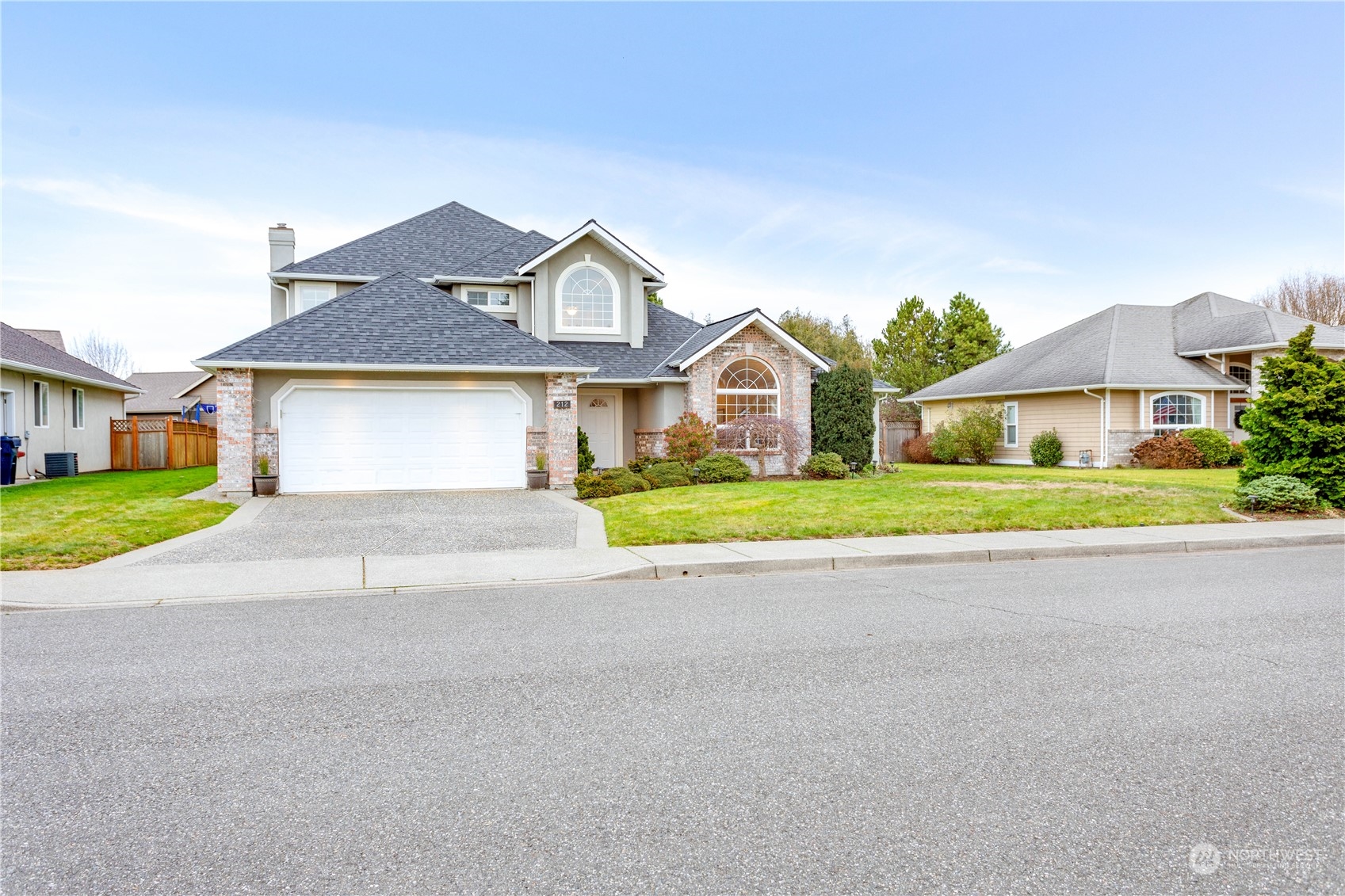 212 Springview Drive Lynden, WA 98264 - Photo 39 of 40 a front view of a house with a garden and yard
