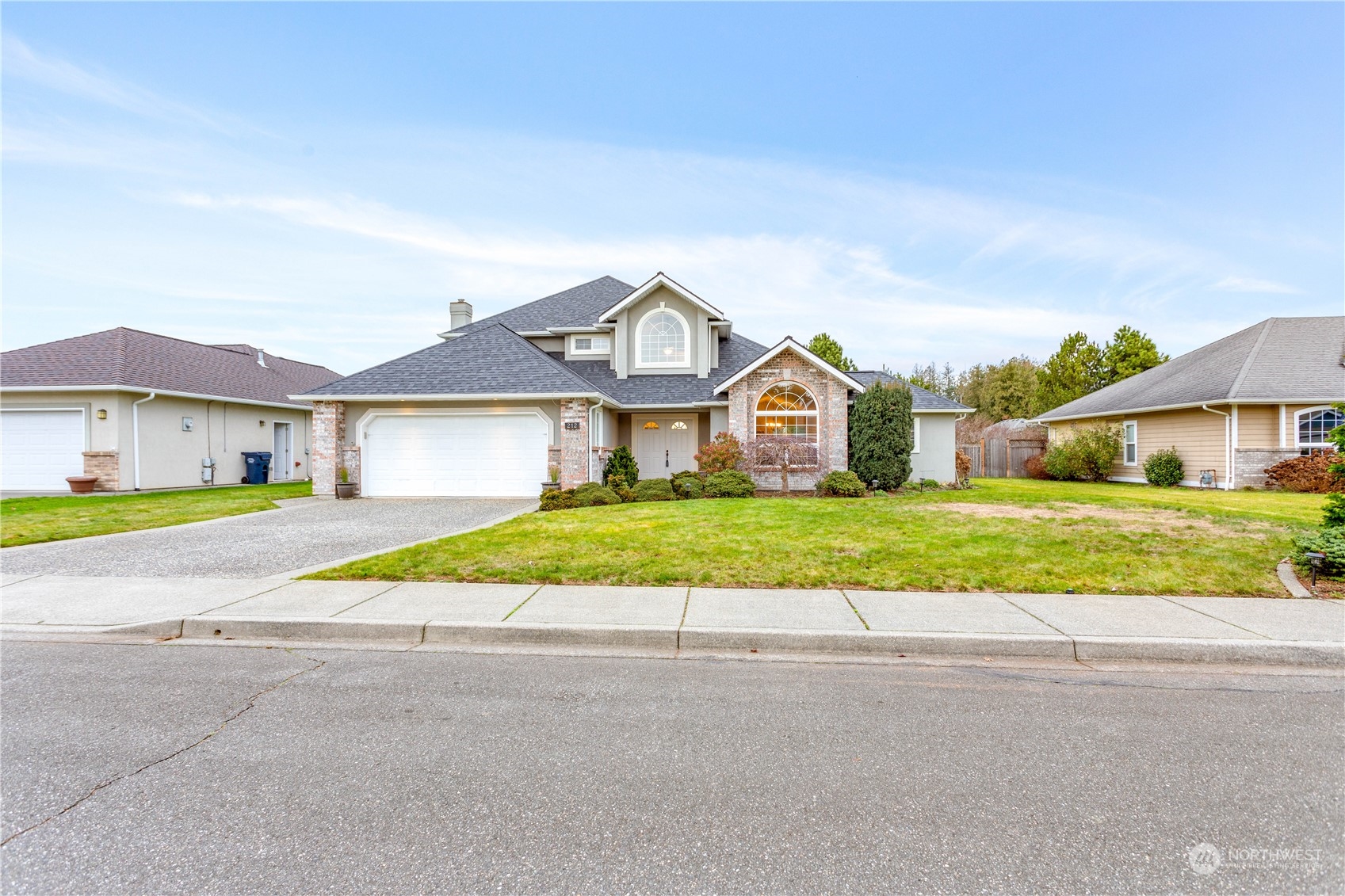 212 Springview Drive Lynden, WA 98264 - Photo 40 of 40 a front view of a house with a yard and garage