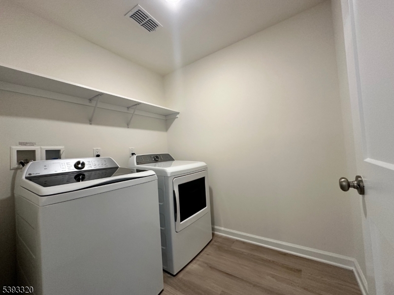 203 Honeysuckle Lane Warren, NJ 07059 - Photo 14 of 22 a utility room with dryer and washer