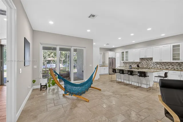 a kitchen with stainless steel appliances granite countertop a sink and cabinets