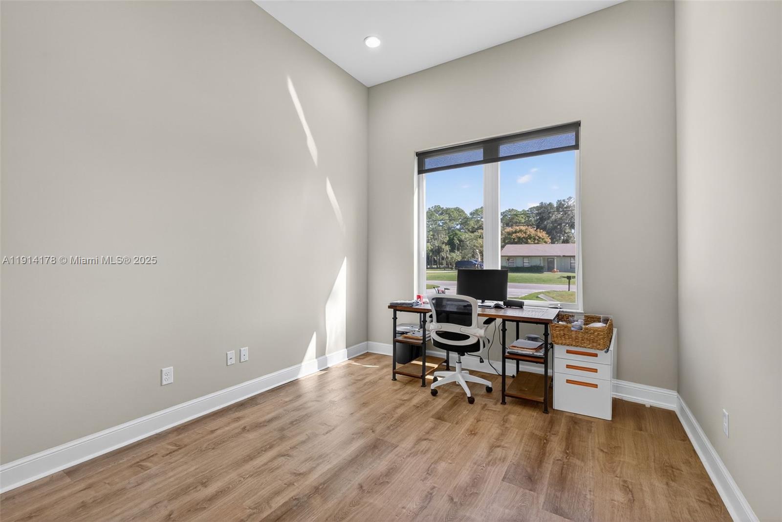 18369 Mellen Lane Jupiter, FL 33478 - Photo 34 of 84 a view of a workspace with furniture and a window