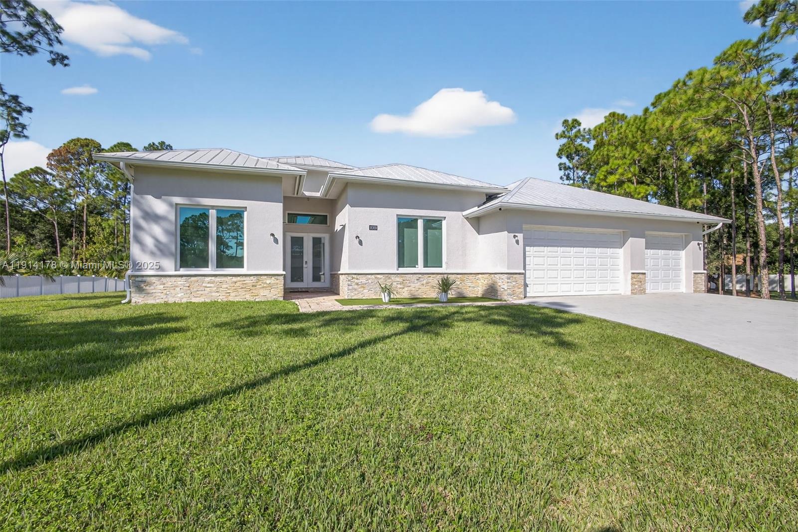 18369 Mellen Lane Jupiter, FL 33478 - Photo 4 of 84 a view of a house with a backyard