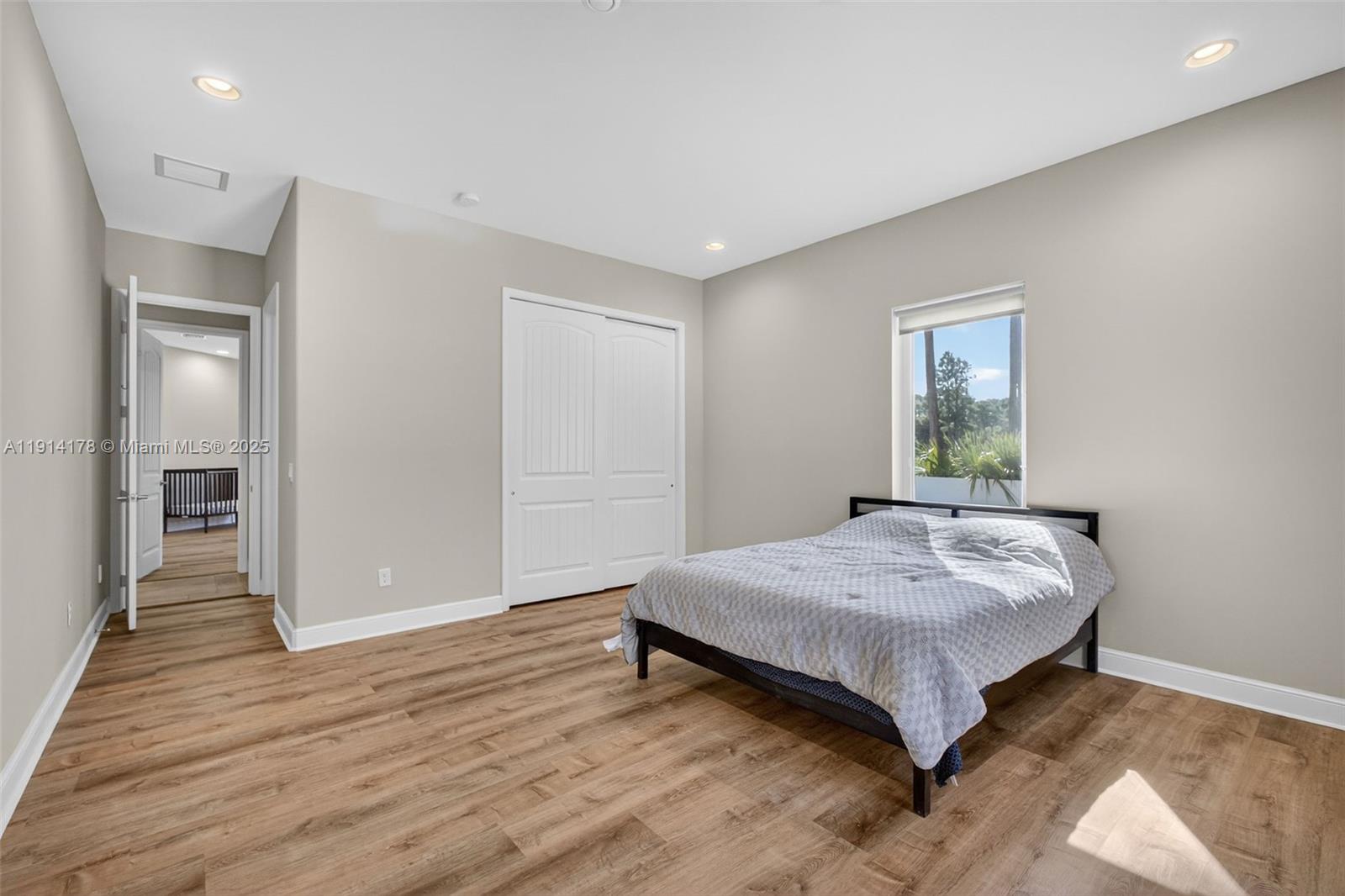 18369 Mellen Lane Jupiter, FL 33478 - Photo 41 of 84 a bedroom with a bed and a window