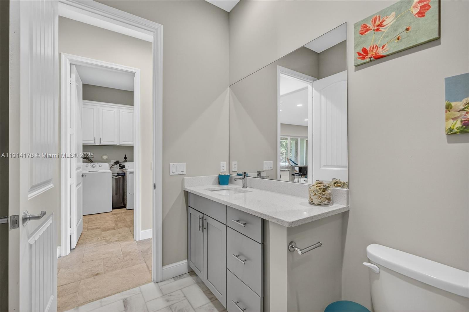 18369 Mellen Lane Jupiter, FL 33478 - Photo 43 of 84 a spacious bathroom with a sink toilet vanity and tub