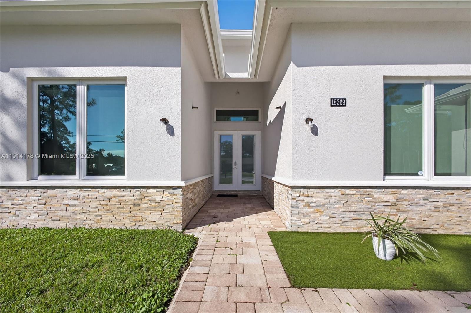 18369 Mellen Lane Jupiter, FL 33478 - Photo 5 of 84 a view of front door of house