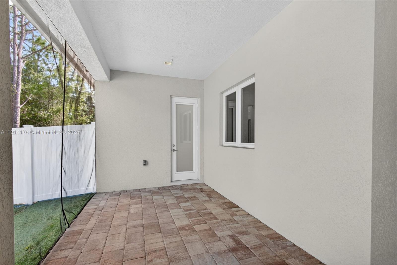 18369 Mellen Lane Jupiter, FL 33478 - Photo 56 of 84 a view of an empty room with a window
