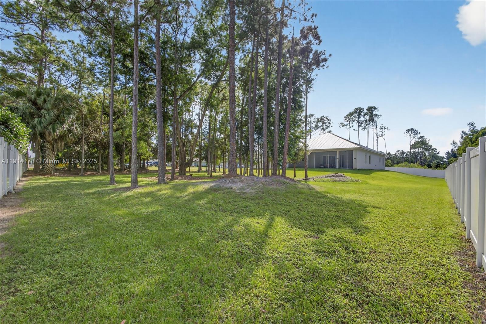 18369 Mellen Lane Jupiter, FL 33478 - Photo 66 of 84 a view of a house with garden and trees
