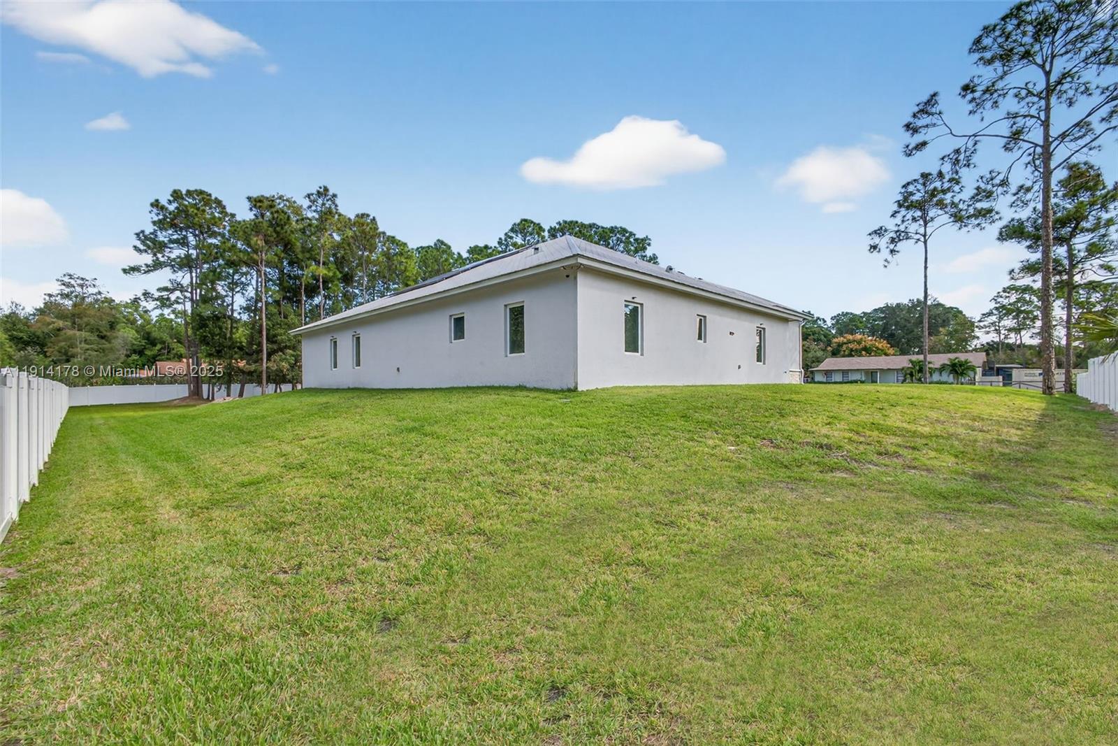 18369 Mellen Lane Jupiter, FL 33478 - Photo 67 of 84 a view of a house with a yard