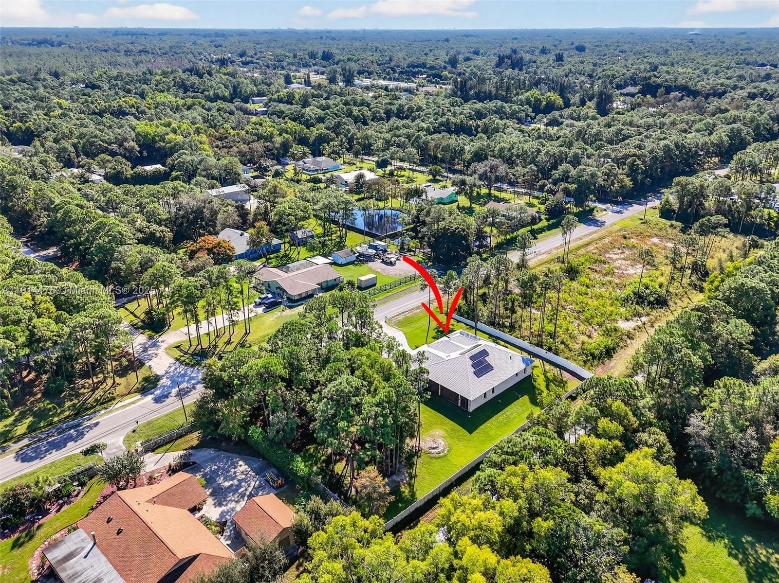 18369 Mellen Lane Jupiter, FL 33478 - Photo 79 of 84 an aerial view of residential houses with outdoor space