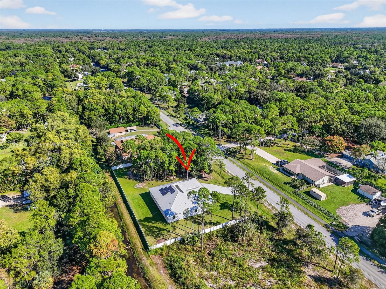 18369 Mellen Lane Jupiter, FL 33478 - Photo 81 of 84 a view of a yard with an outdoor space