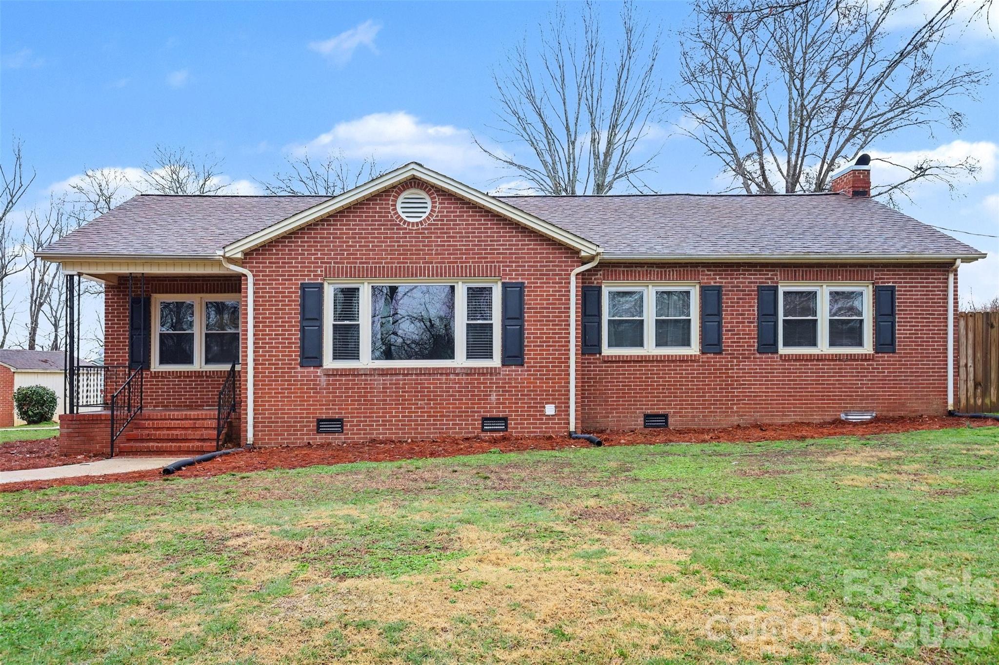 1008 Edgewood Road Bessemer City, NC 28016 - Photo 1 of 26 a front view of a house with a yard