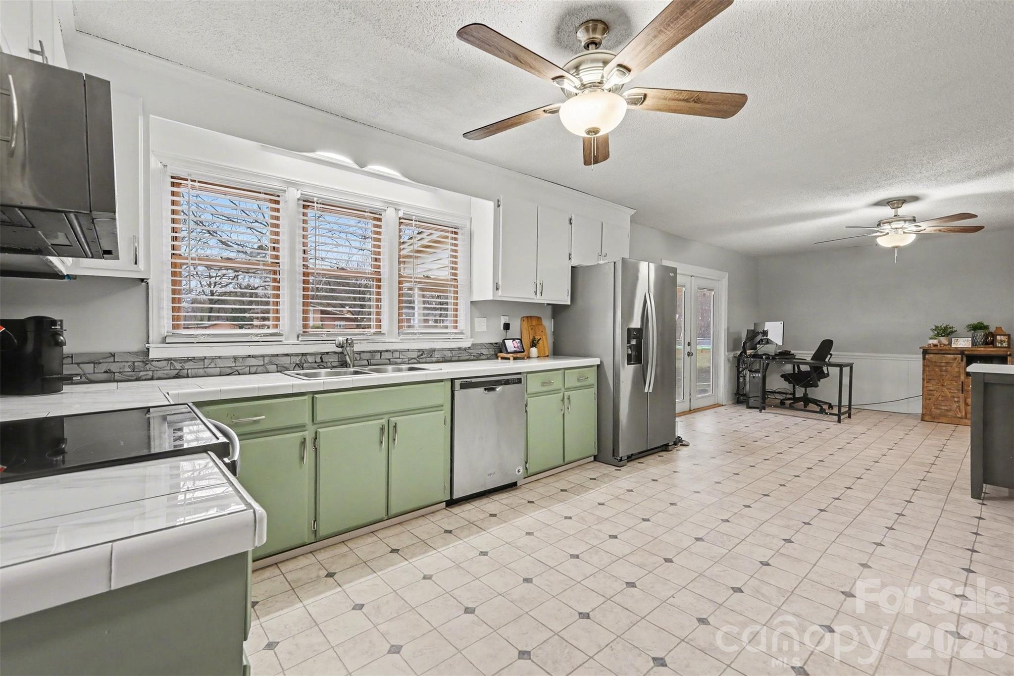 1008 Edgewood Road Bessemer City, NC 28016 - Photo 12 of 26 a kitchen with a sink cabinets and window