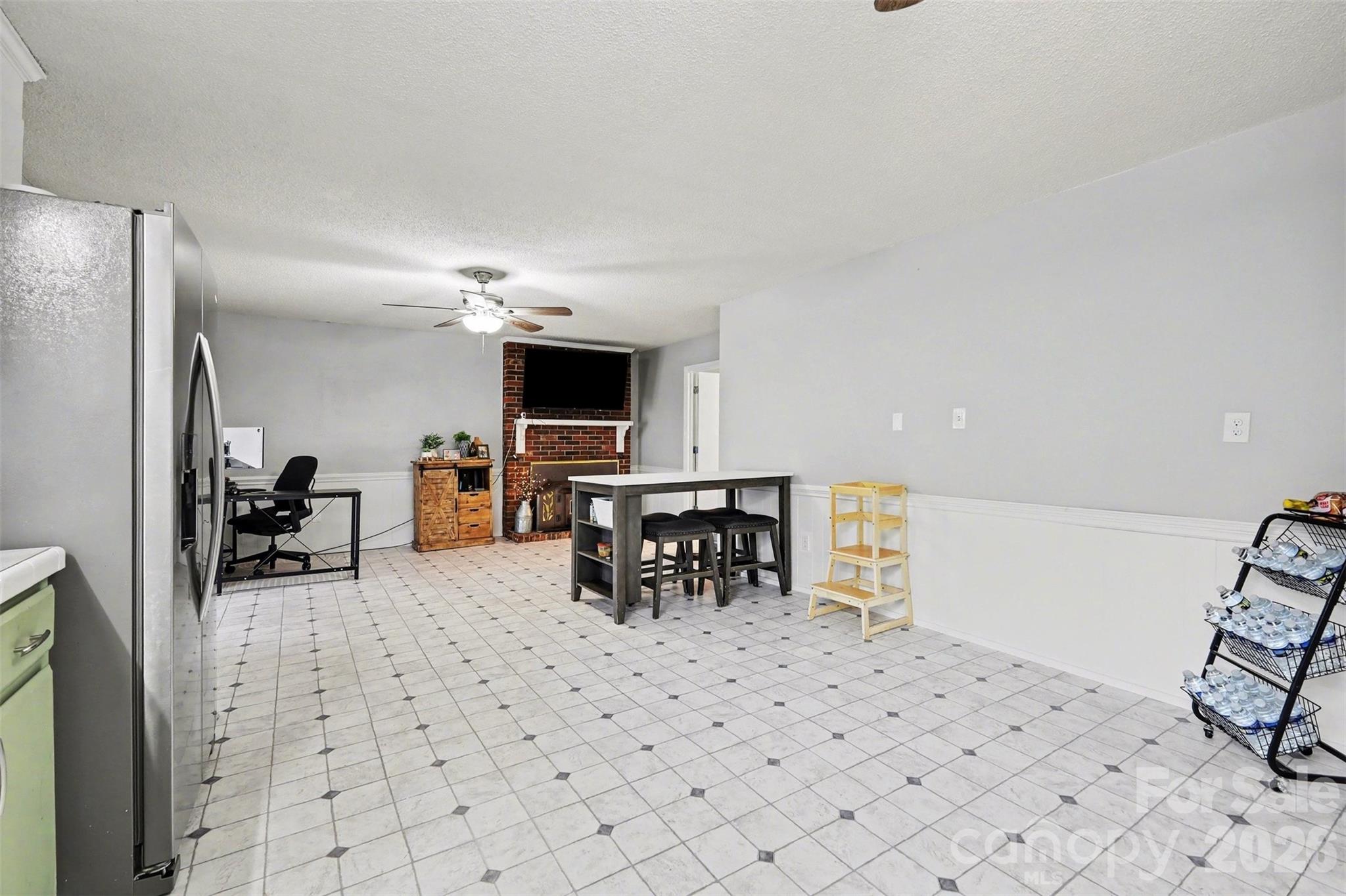 1008 Edgewood Road Bessemer City, NC 28016 - Photo 15 of 26 a living room with furniture a table and chairs
