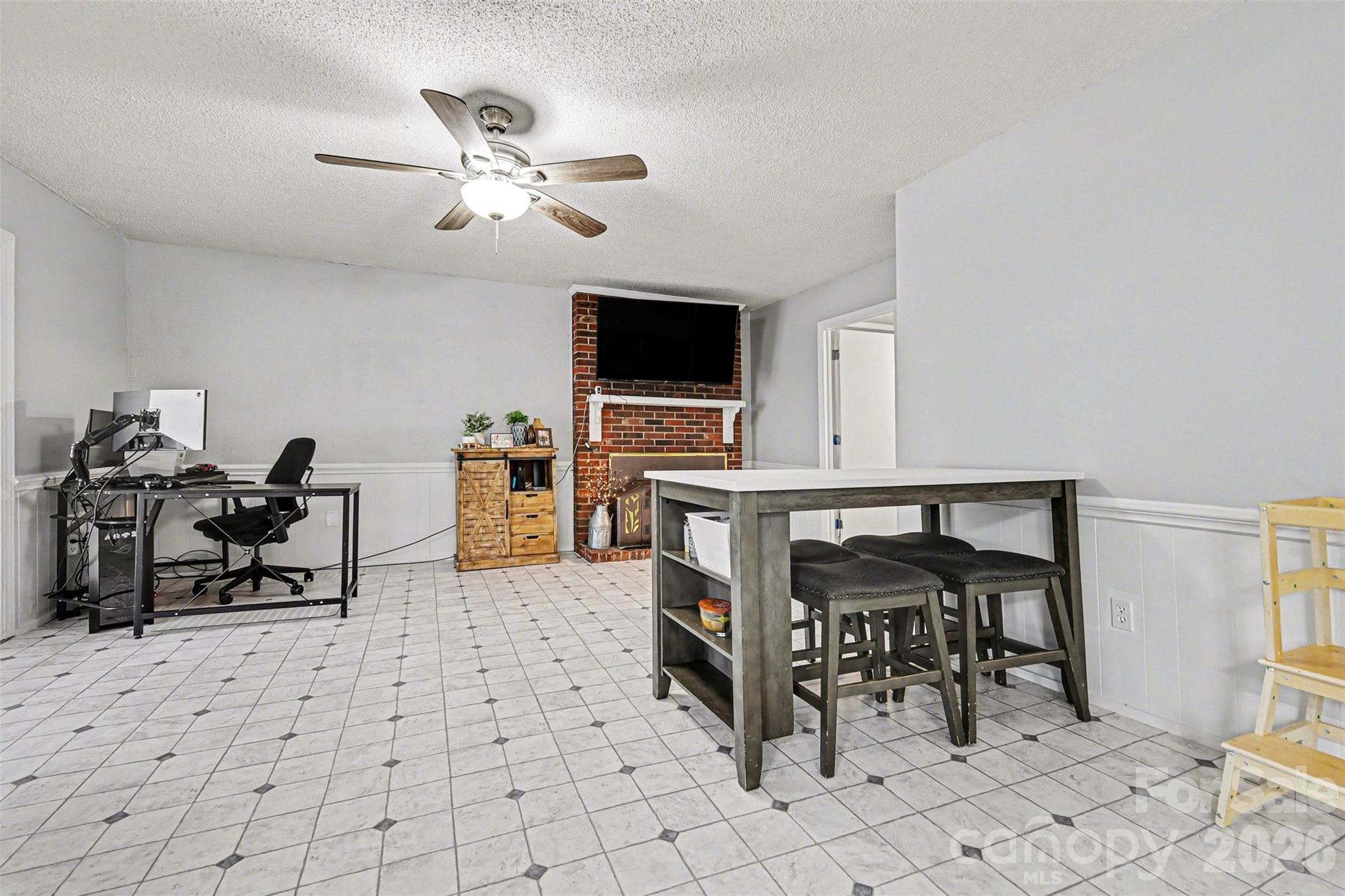 1008 Edgewood Road Bessemer City, NC 28016 - Photo 16 of 26 a living room with furniture and a flat screen tv